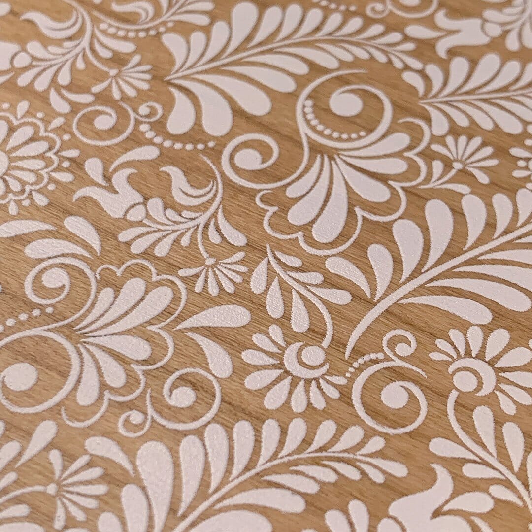 Zoomed in detailed shot of the white ink flowing botanical print on Cherry wood Galaxy S25+ Case by Keyway Designs