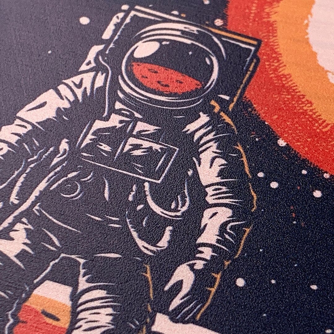 Zoomed in detailed shot of the stylized astronaut space-walk print on Cherry wood iPhone 16 Pro Max MagSafe Case by Keyway Designs