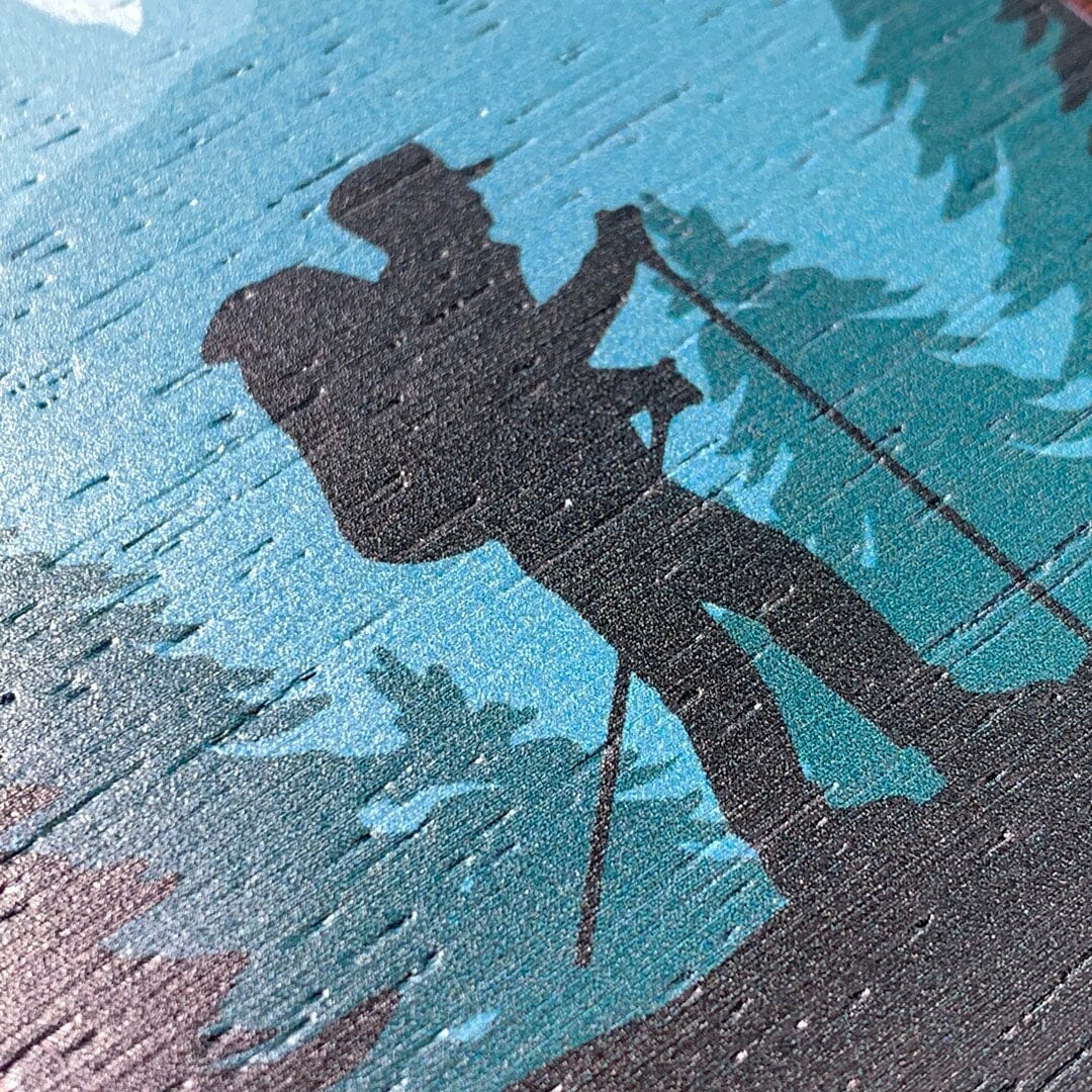 Zoomed in detailed shot of the stylized mountain hiker print on Wenge wood iPhone 16 Pro Max MagSafe Case by Keyway Designs