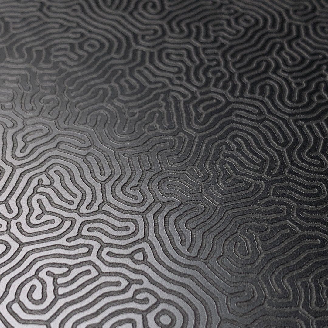 Zoomed in detailed shot of the highly detailed organic growth engraving on matte black impact acrylic Galaxy S25 Plus Case by Keyway Designs