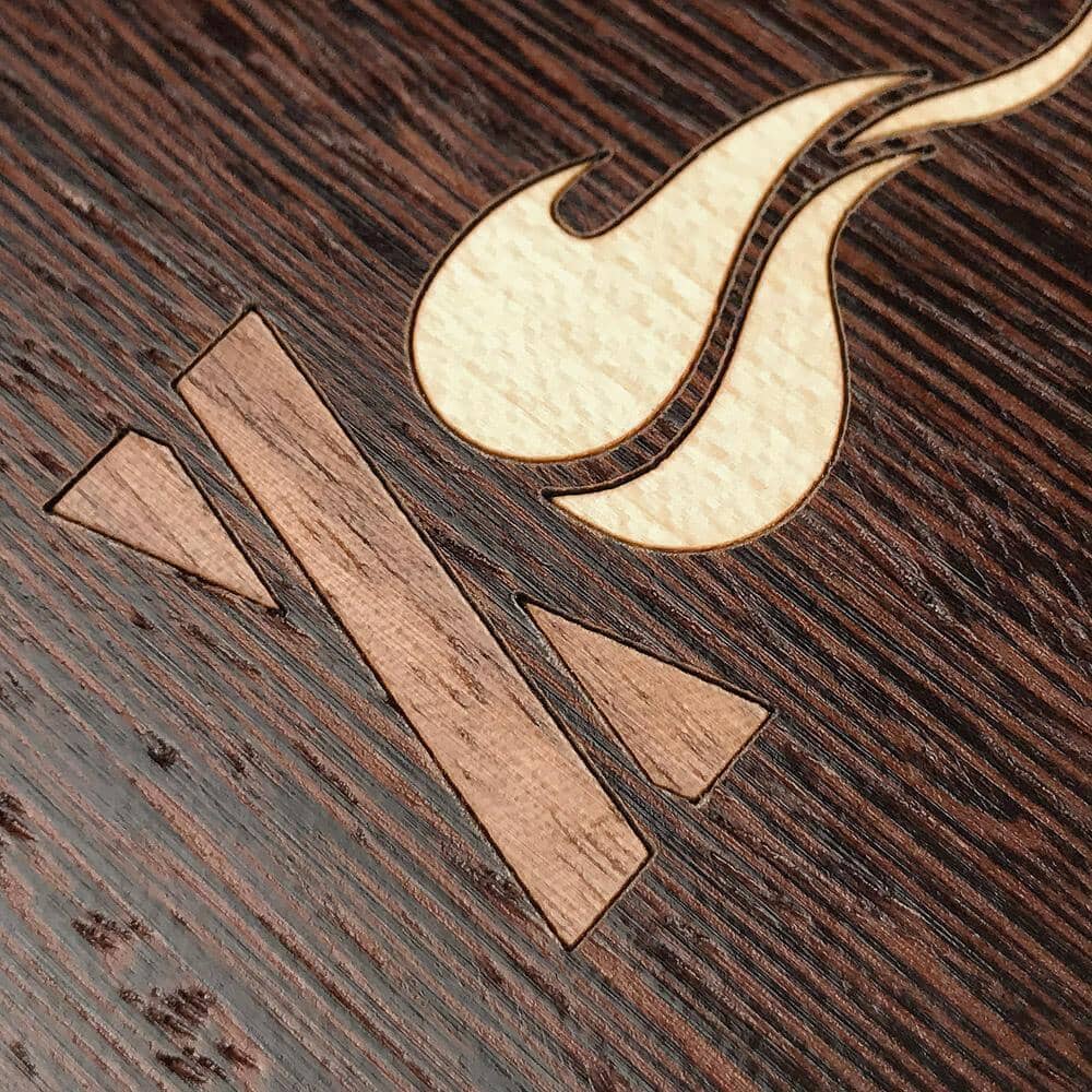 Zoomed in detailed shot of the Nomad Campsite Wood iPhone 16 Pro MagSafe Case by Keyway Designs