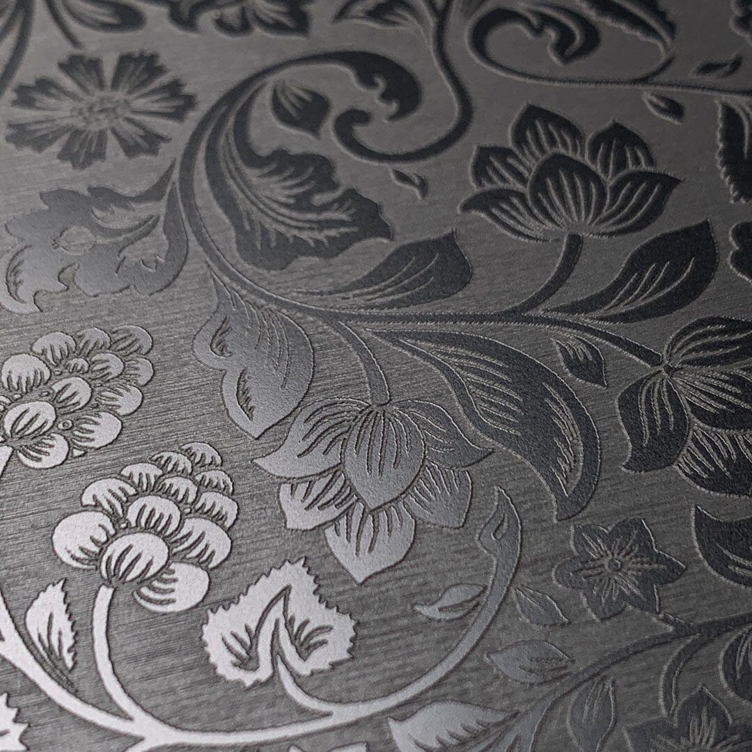 Zoomed in detailed shot of the highly detailed midnight floral engraving on matte black impact acrylic Galaxy S25 Ultra Case by Keyway Designs