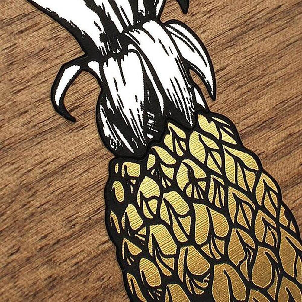 Zoomed in detailed shot of the Pineapple Walnut Wood iPhone 16 Plus MagSafe Case by Keyway Designs