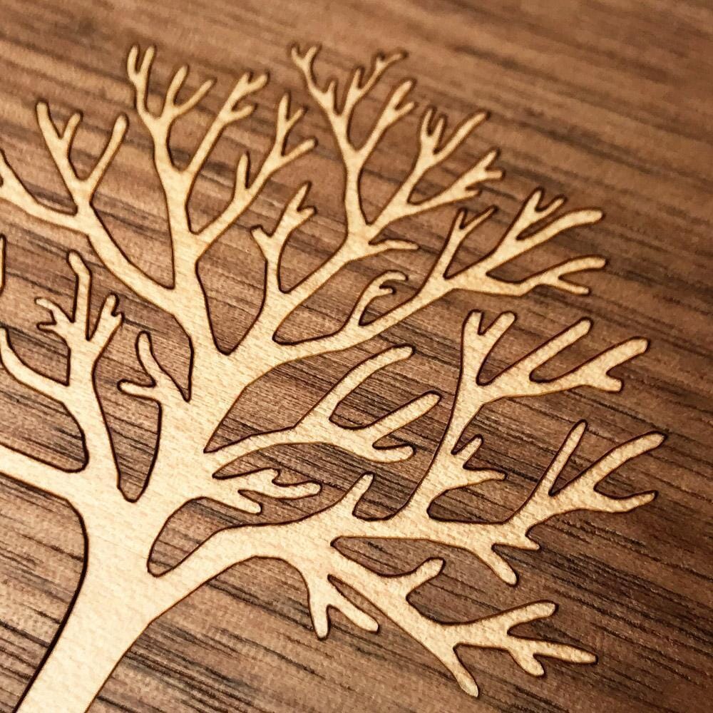 Zoomed in detailed shot of the Tree Of Life Walnut Wood iPhone 16 Pro MagSafe Case by Keyway Designs