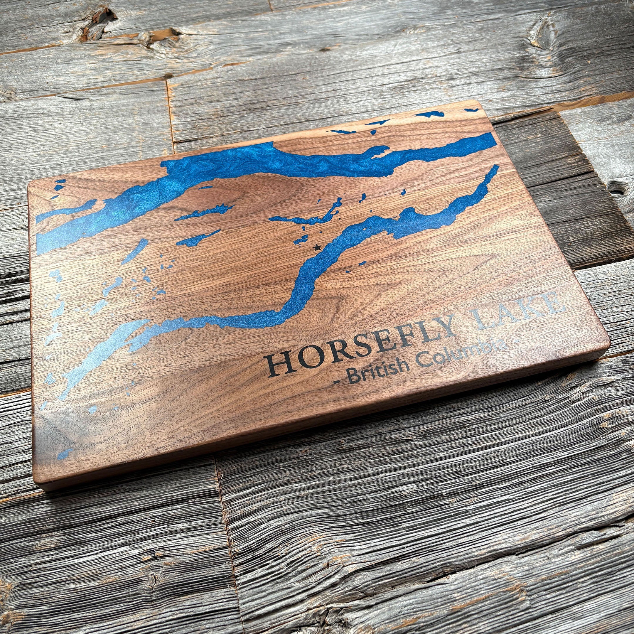 Custom wooden wall art featuring a blue epoxy resin inlay map of Horsefly Lake, British Columbia, ideal for unique personalized décor or gifts.