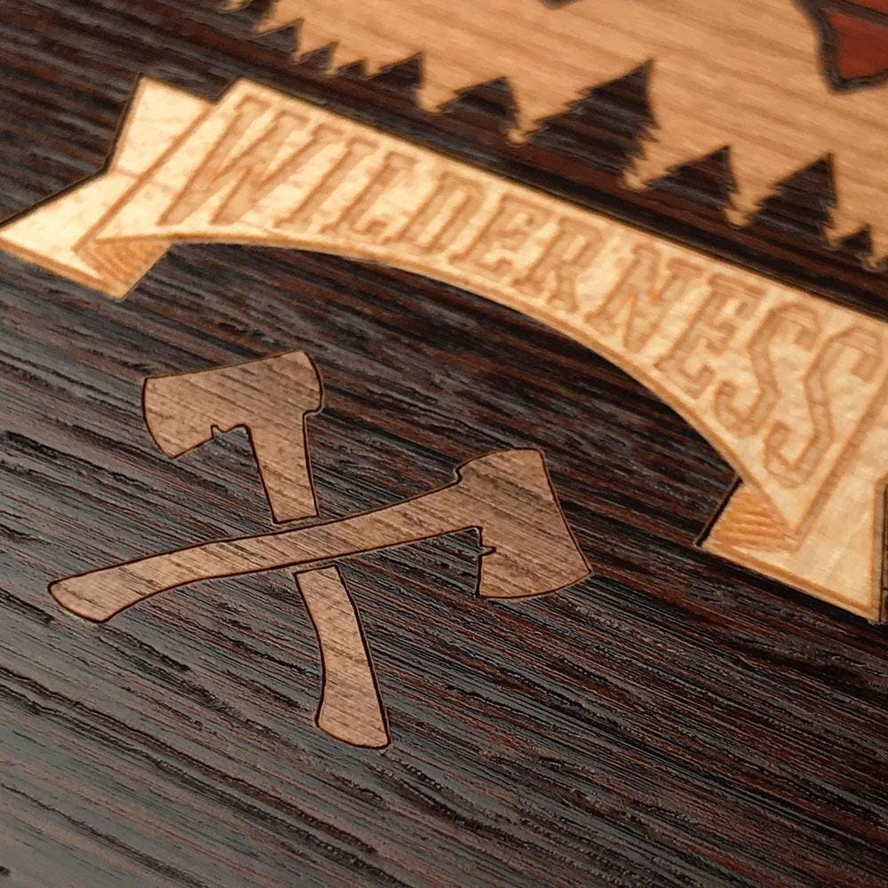Zoomed in detailed shot of the Wilderness Wenge Wood iPhone 15 Pro Max MagSafe Case by Keyway Designs